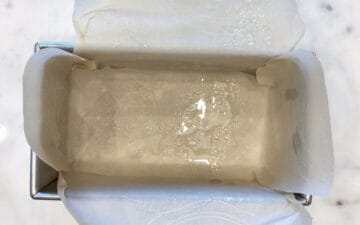 Lined and greased loaf pan.