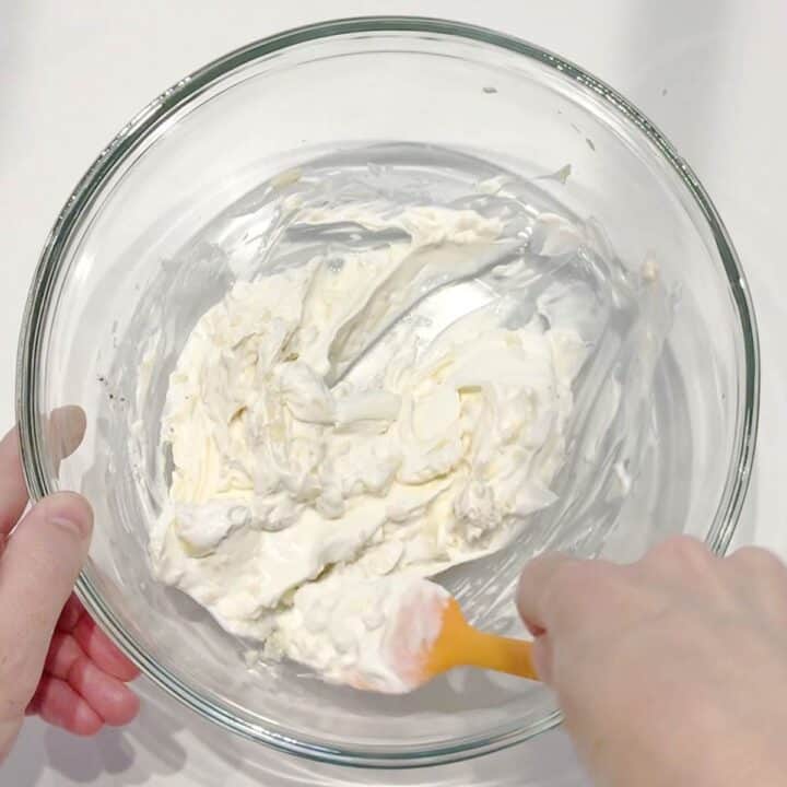 Mixing the sauce in a bowl.