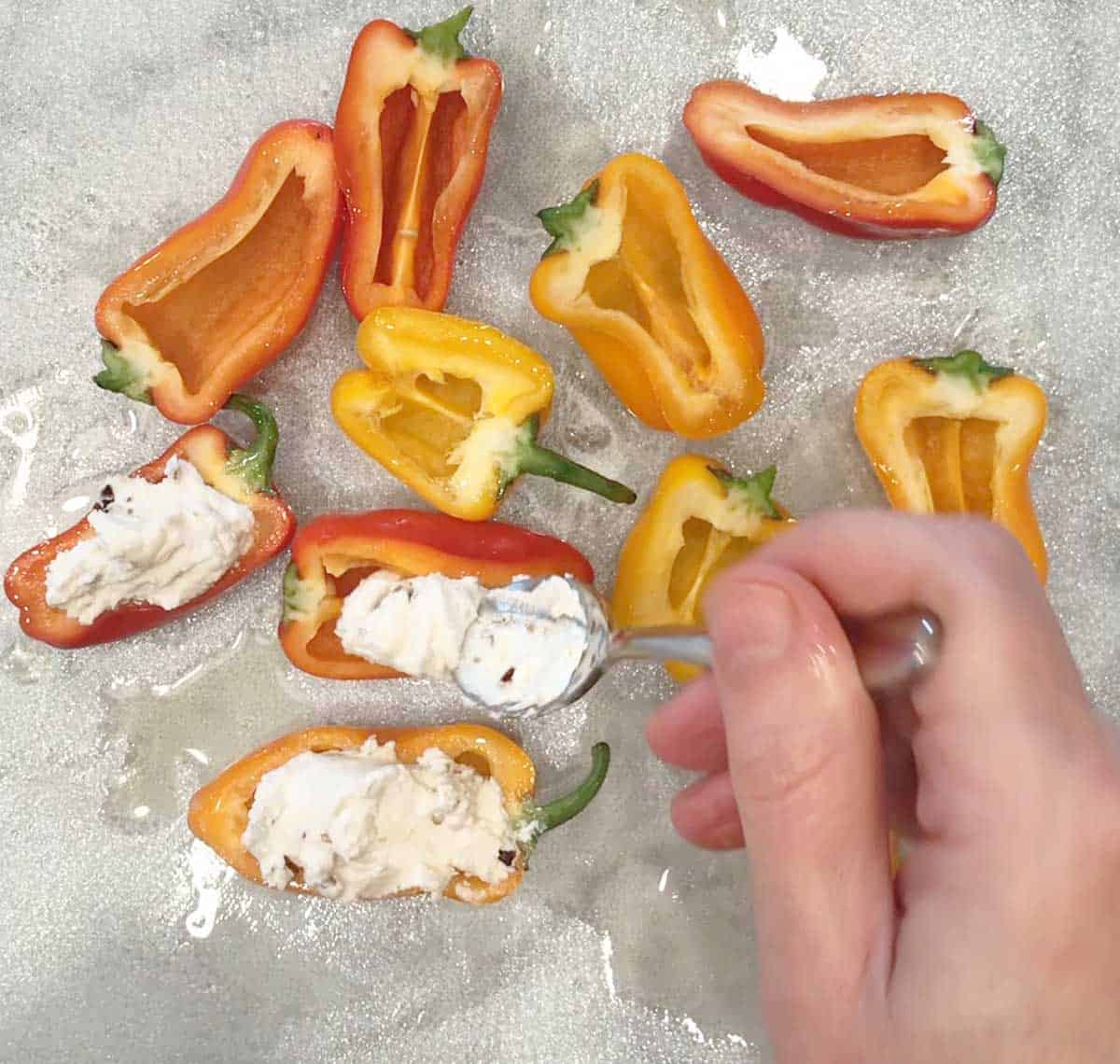 Stuffing the peppers.