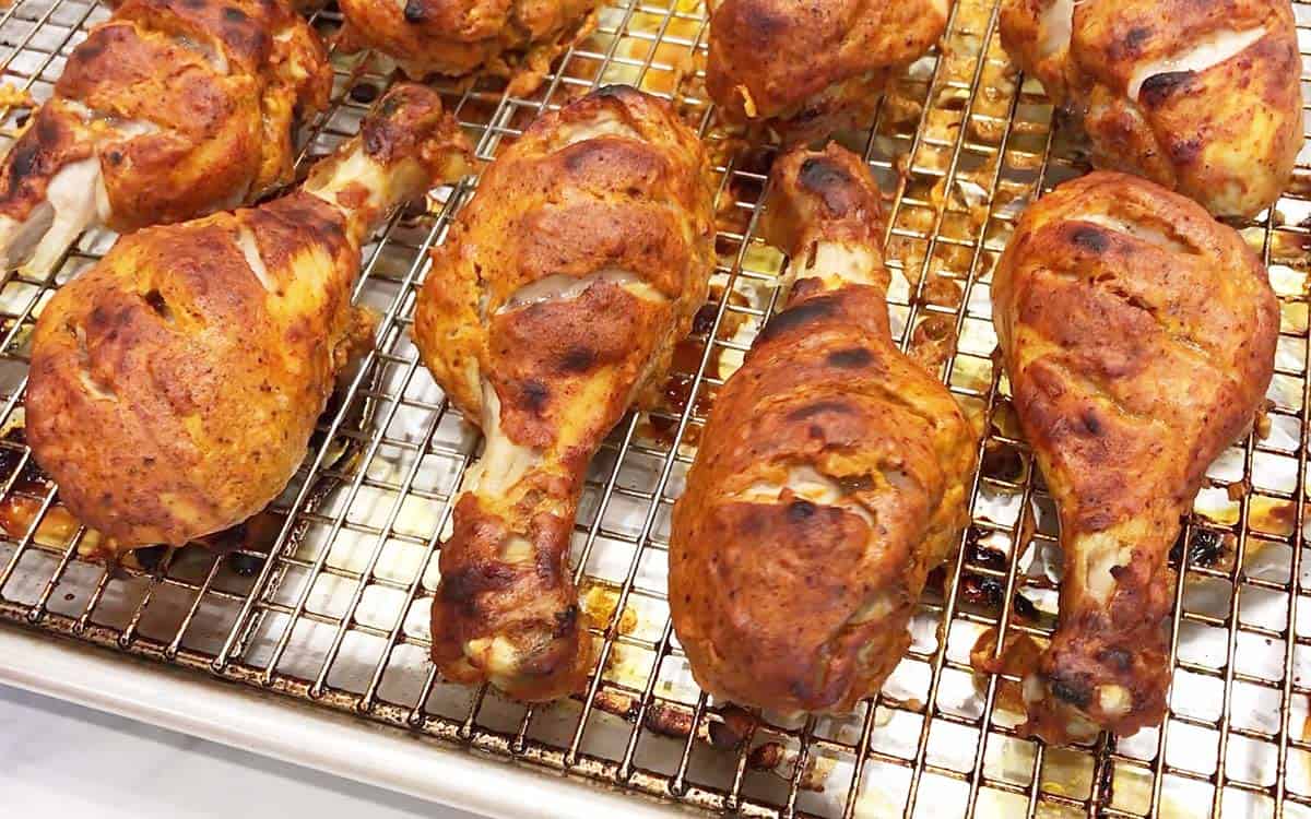 Tandoori chicken is fully baked and ready in the pan.