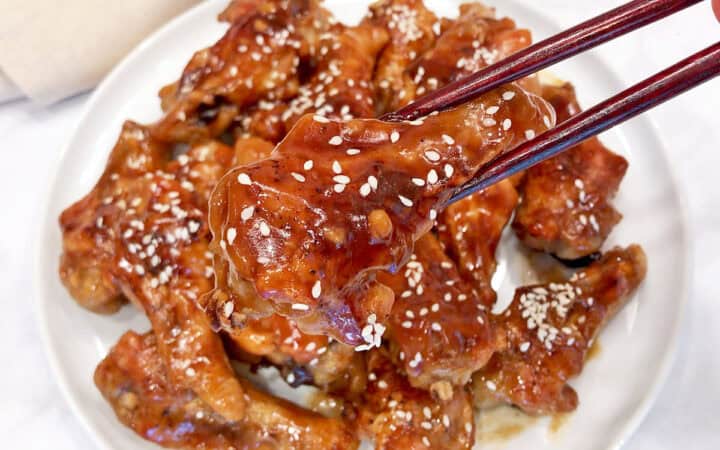 The wings are eaten with chopsticks.