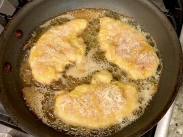 Cooking the tenders in a skillet.