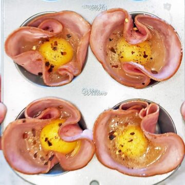 Eggs were added to the cups and seasoned with spices.