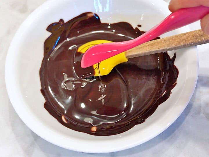 Adding stevia to the melted chocolate.