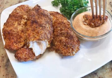 The chicken tenders are served with the dipping sauce.