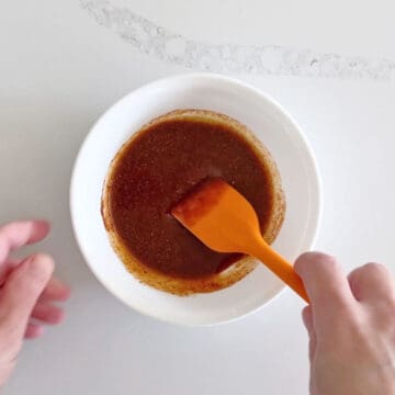 Mixing the seasoning mix in a bowl.