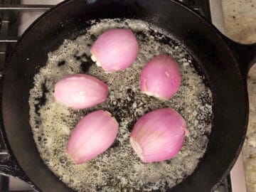 The shallots were added to the skillet, flat side down.