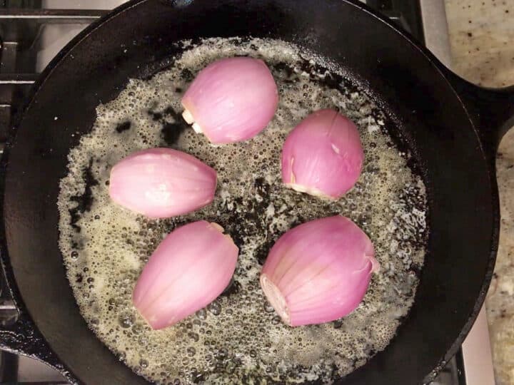 The shallots were added to the skillet, flat side down.