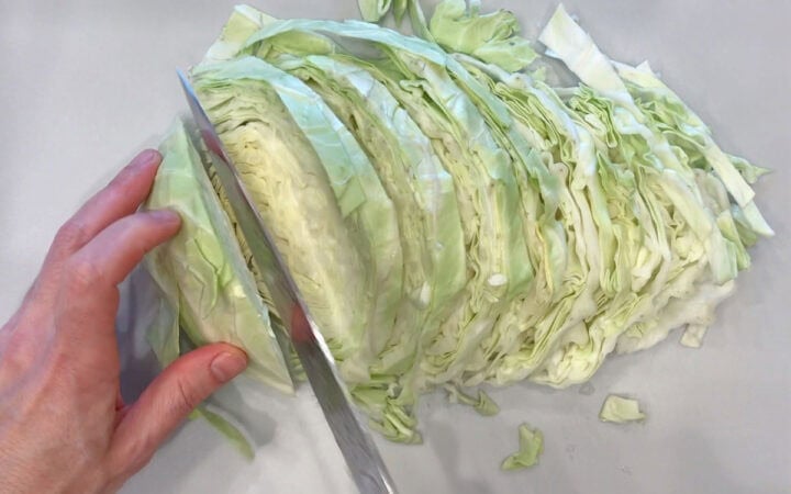 Slicing the cabbage.