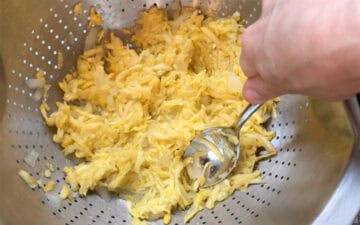 Draining the squash and onions.