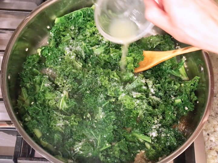 Adding lemon juice to the kale.