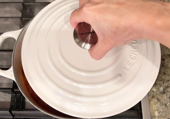 Covering the pot with a lid.