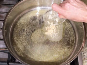 Cooking garlic in butter.