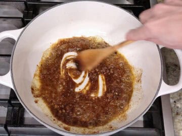 Sauteing garlic and spices in olive oil.