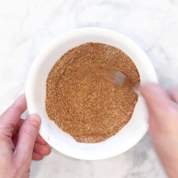 Mixing the spices in a bowl.