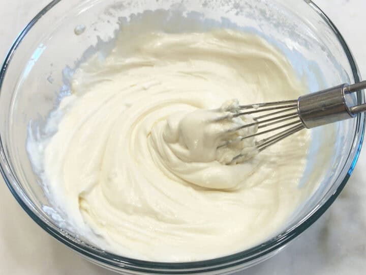 The frosting is ready in a bowl.