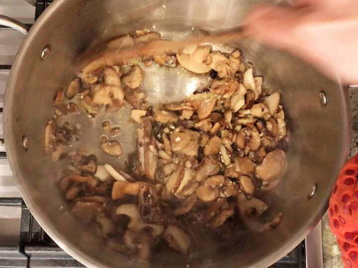 Sauteing the mushrooms.