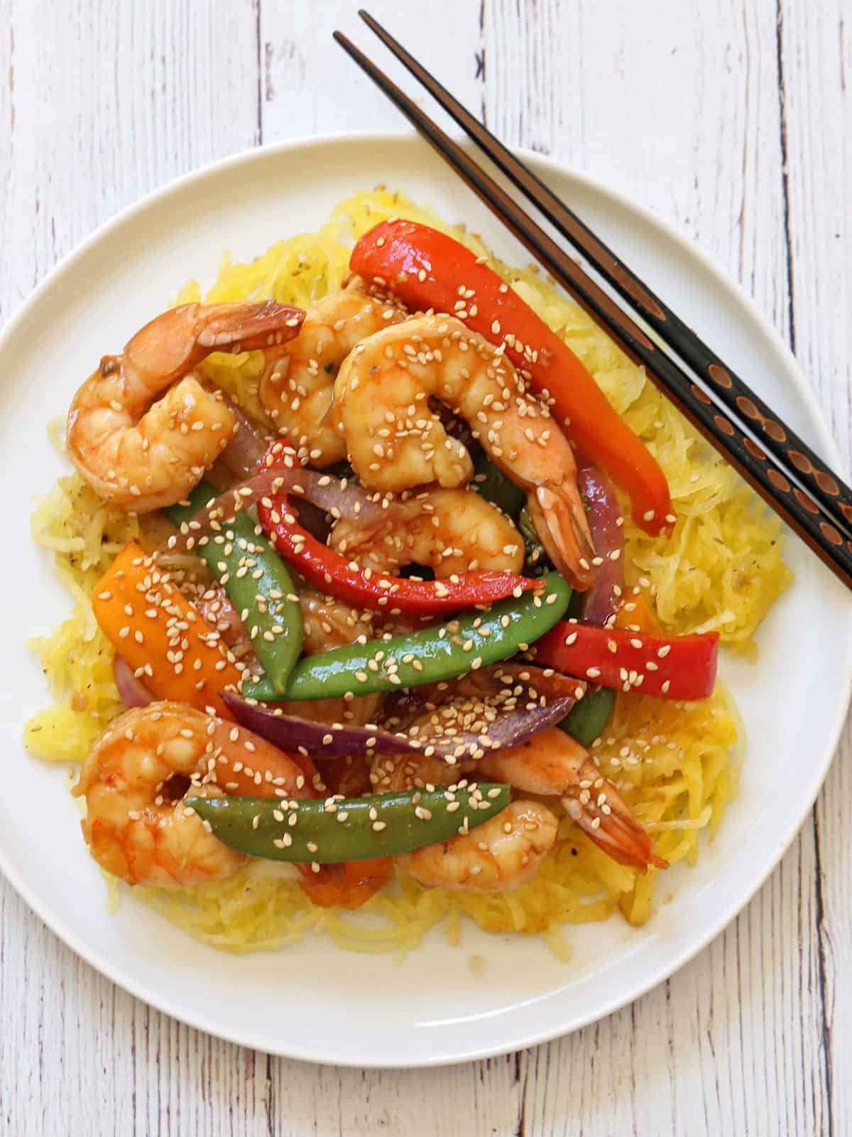 Shrimp stir fry is served on spaghetti squash.