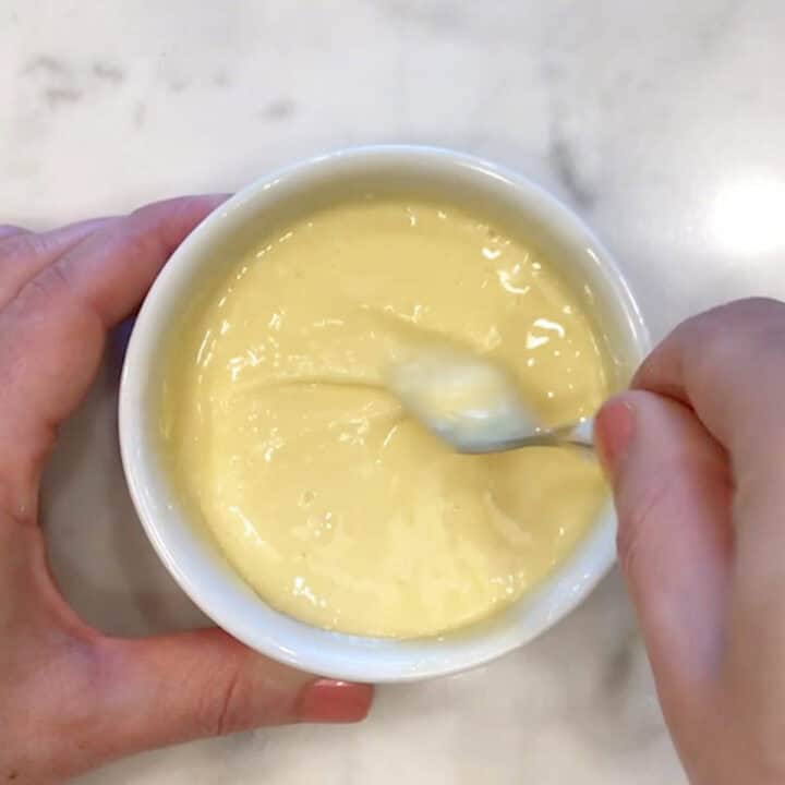 Mixing the egg into the batter.
