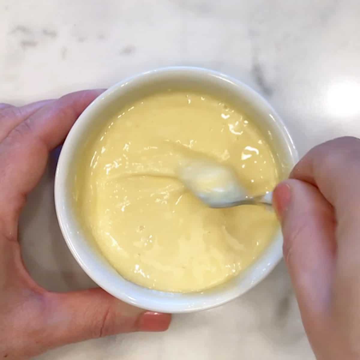 Mixing the egg into the batter.
