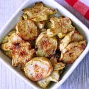 Broccoli stems are served in a white bowl.