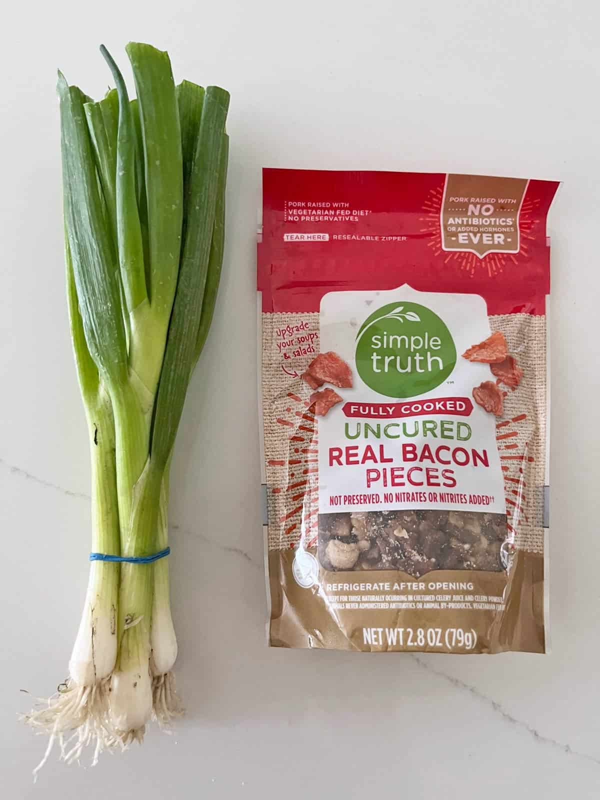 Scallions and bacon bits for topping keto chicken casserole.