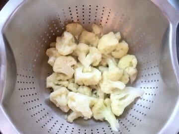 Draining the cauliflower.