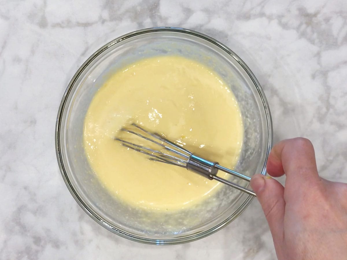 Mixing the ingredients in a bowl.