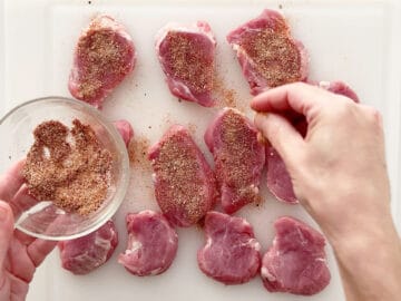 Seasoning the medallions.