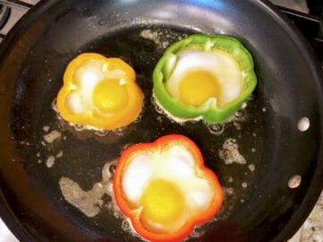 The eggs were added to the bell pepper slices.