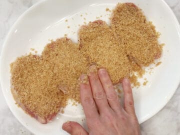 Coating the chops in pork panko.