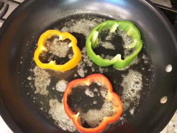 Cooking the peppers in butter.