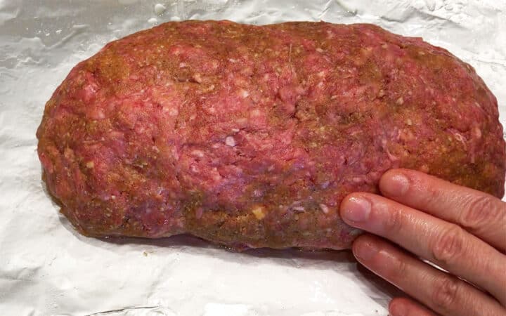 Shaping the meatloaf.
