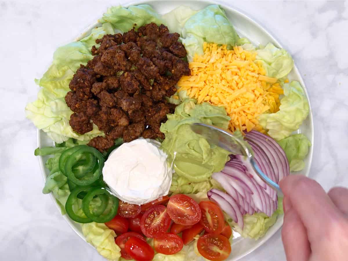 Assembling the salad.