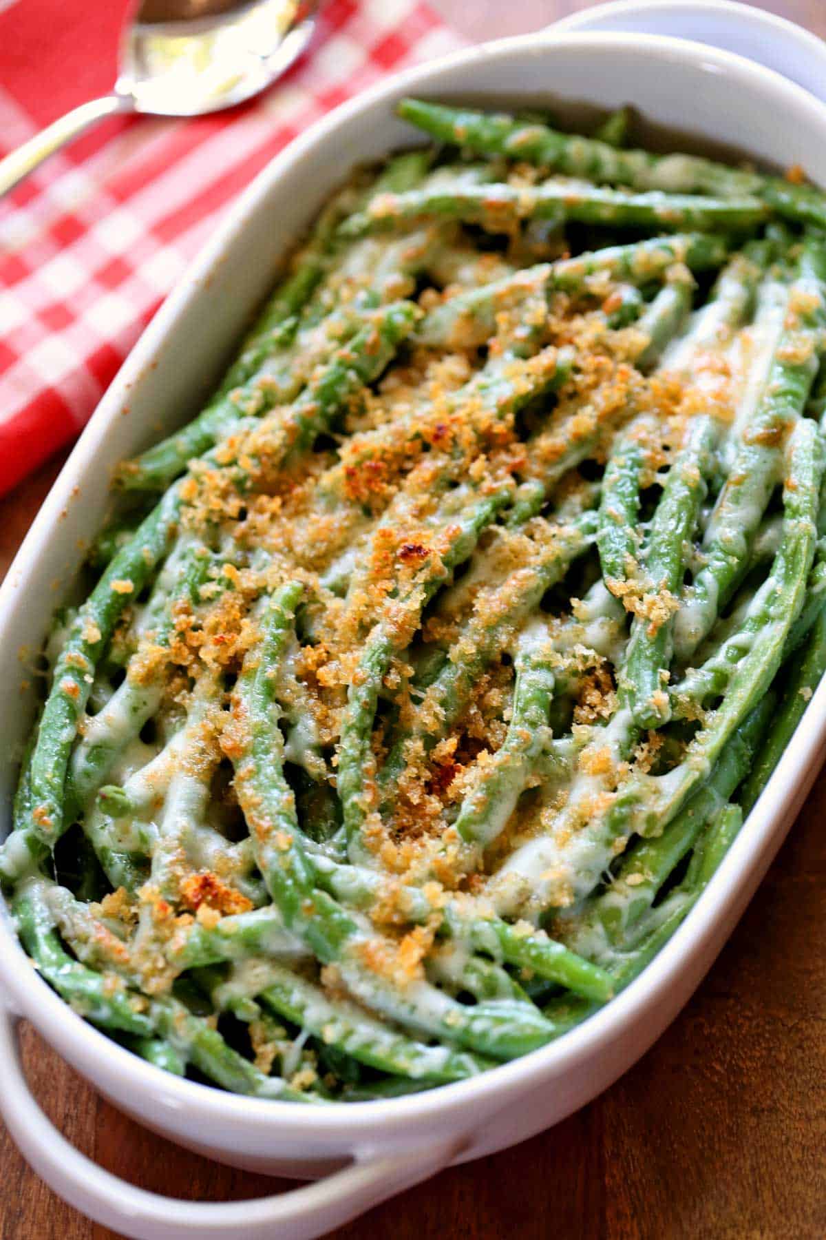 Keto green bean casserole is served in a white baking dish.