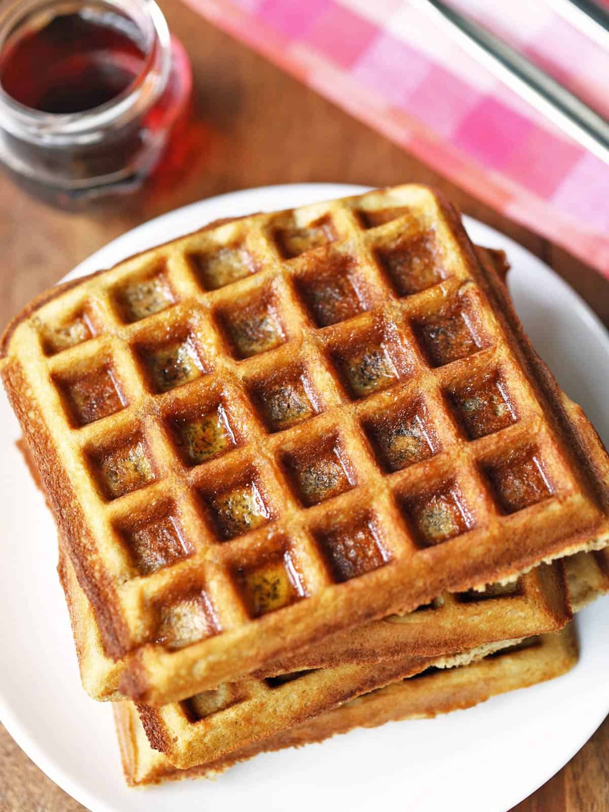 Keto waffles are served with syrup.