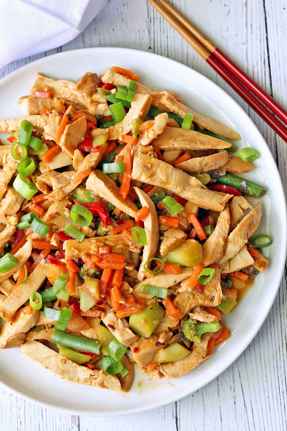 Turkey stir fry is served with chopsticks.