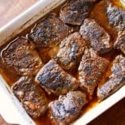 Boneless short ribs in a baking dish.