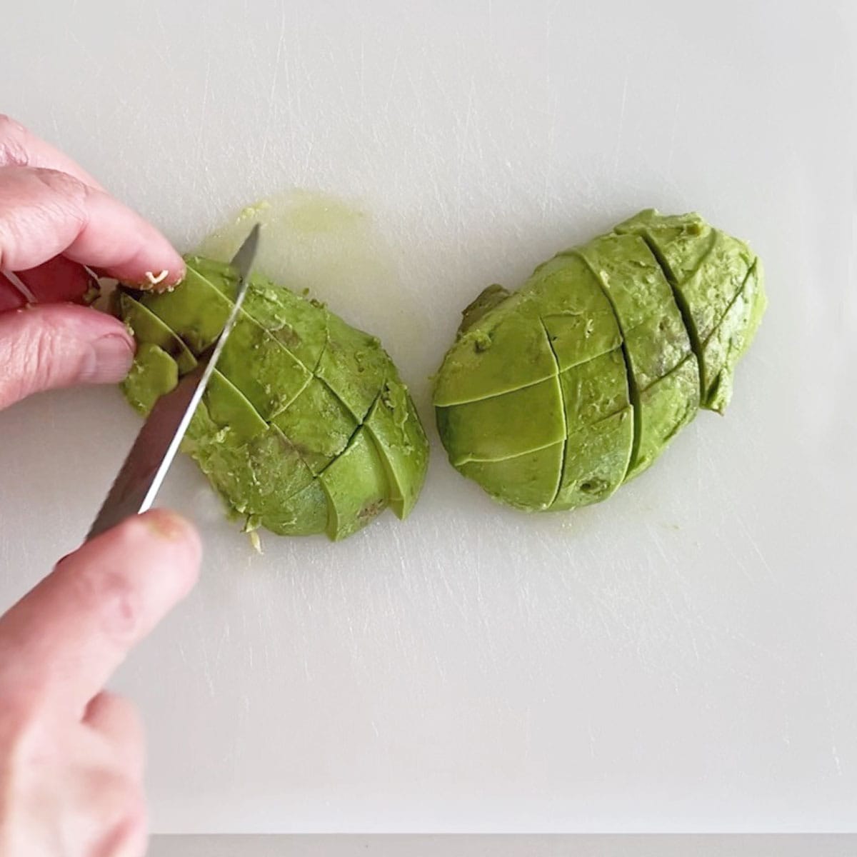 Cubing the avocado.