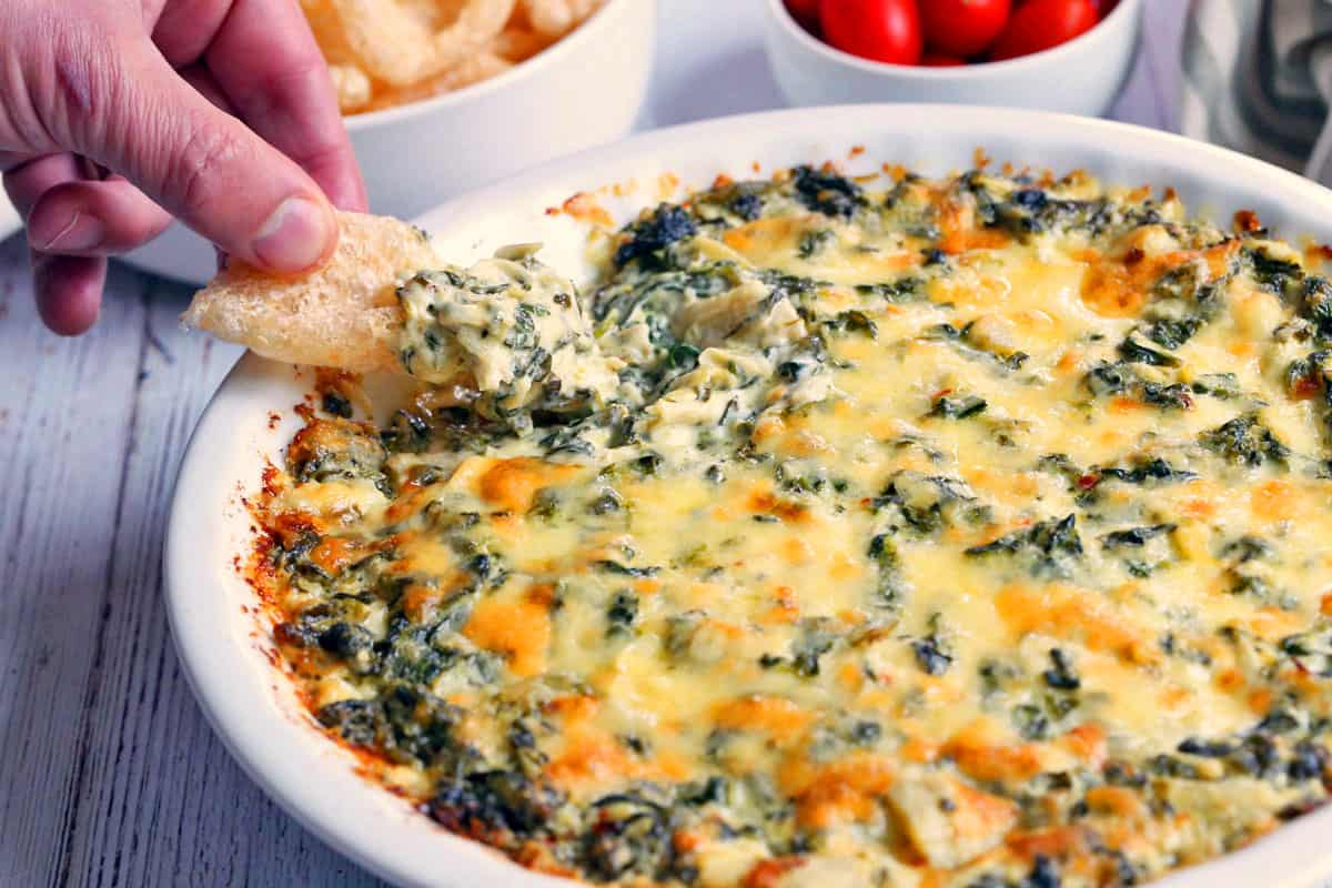 Spinach artichoke dip is served.
