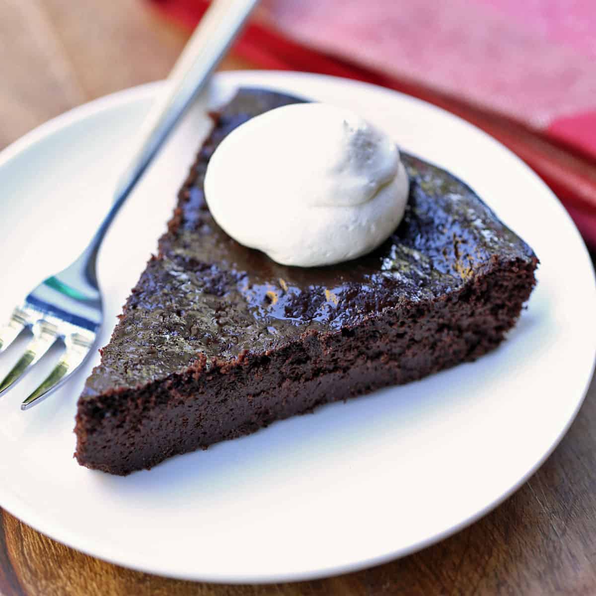 Keto chocolate pie is topped with whipped cream.