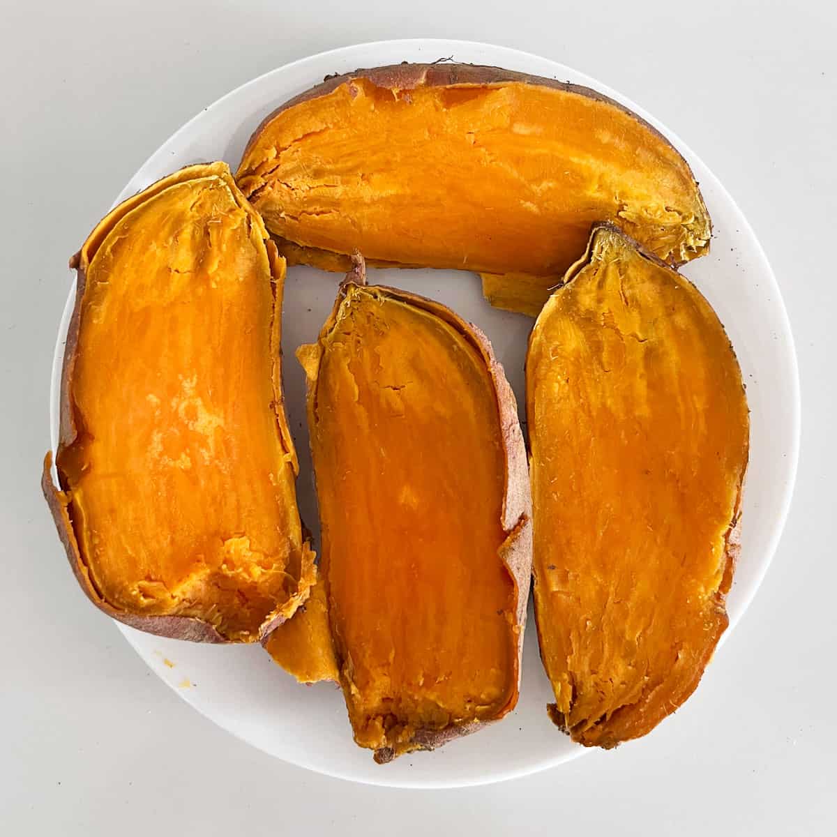 The two sweet potatoes that were cooked together are ready.