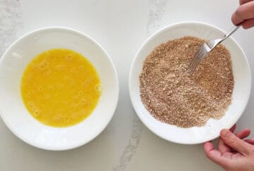 Mixing spices into grated Parmesan.