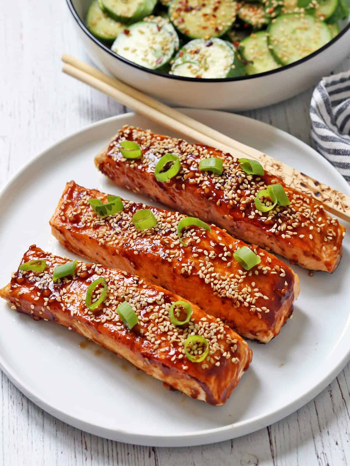 Asian salmon is served with chopsticks.