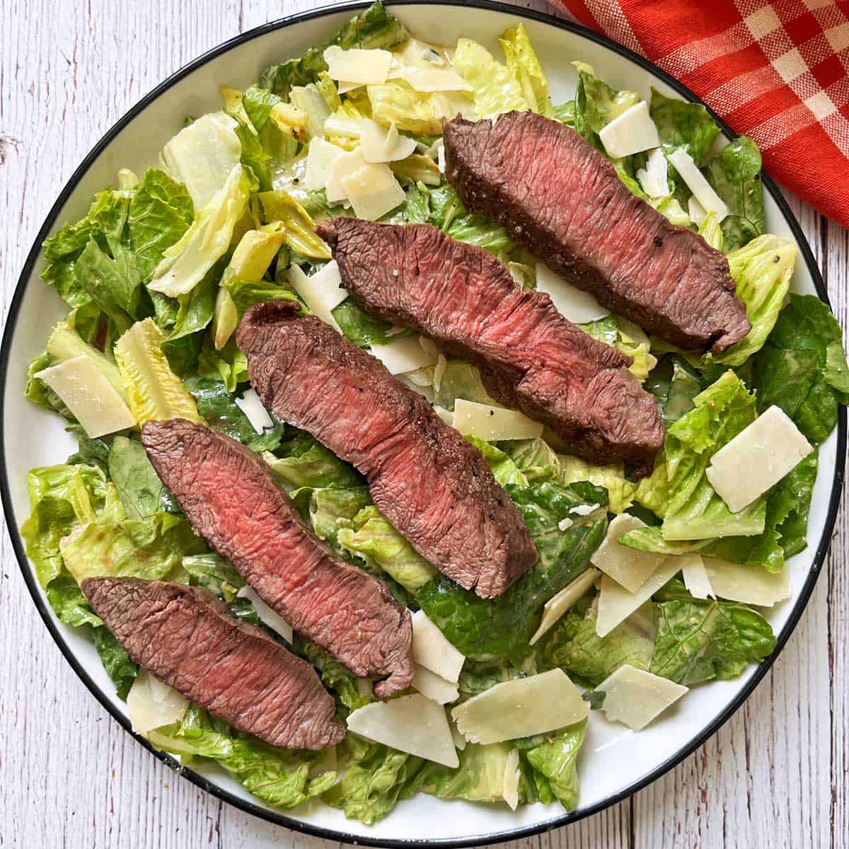 Caesar salad with steak.