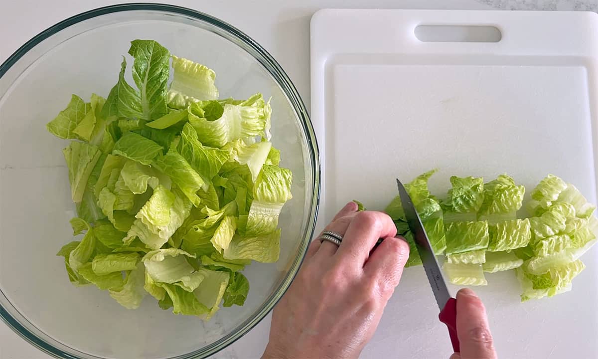 Cutting the lettuce.