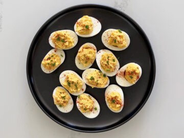 The eggs were garnished with paprika and chives.