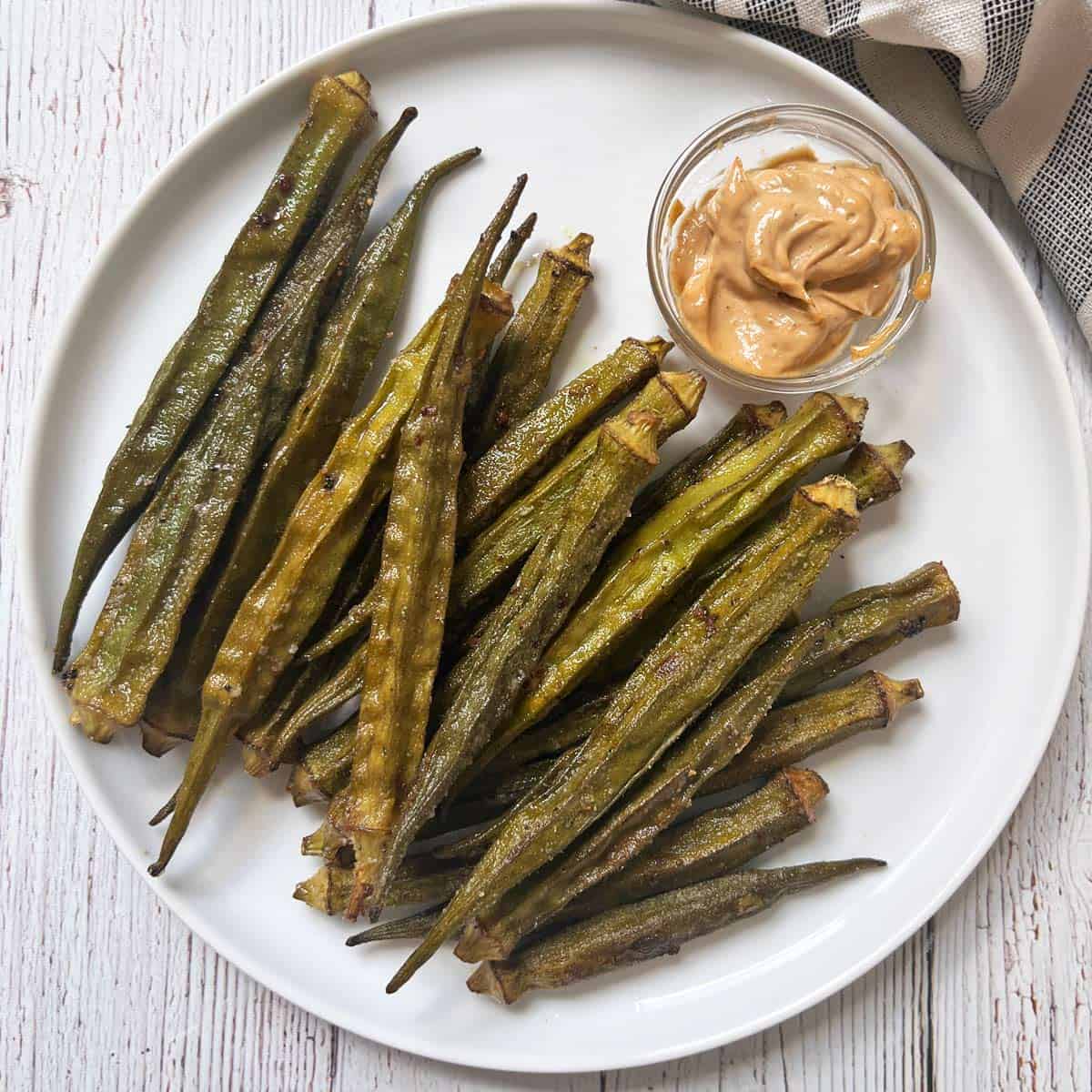 Roasted okra is served with sriracha mayo.