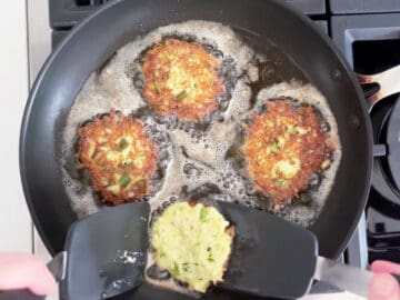 Frying the fritters in a skillet.