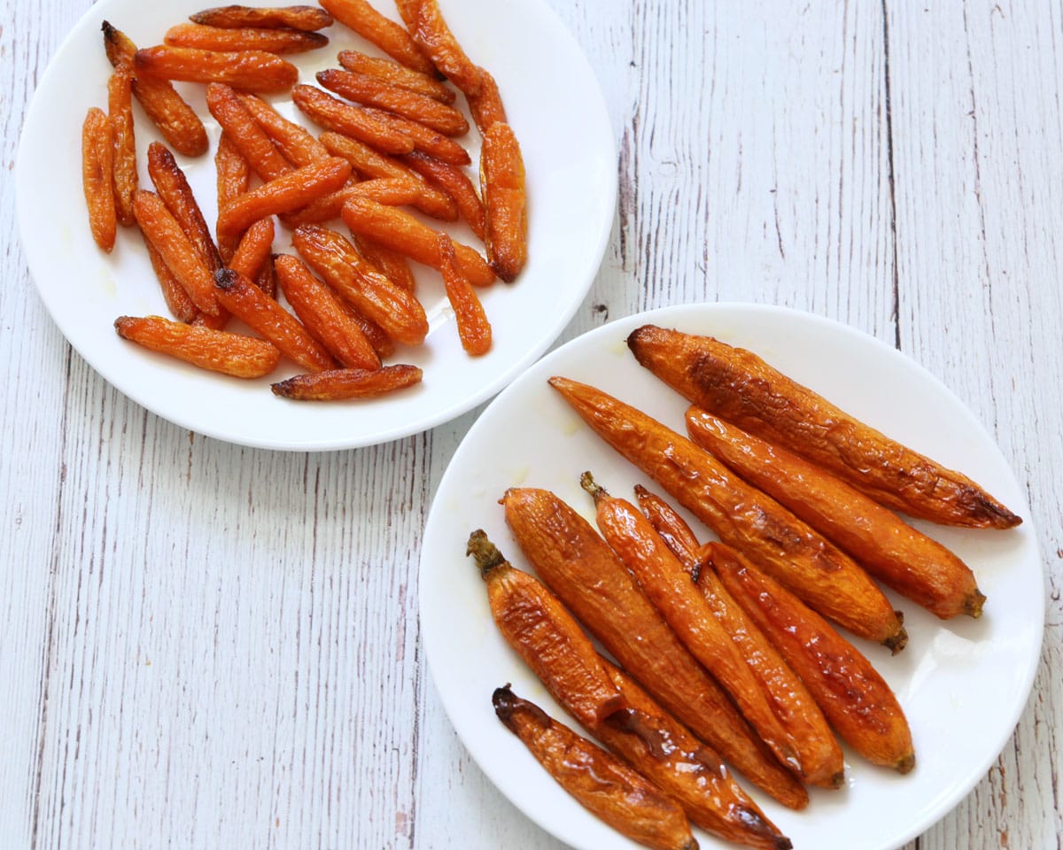 Two types of roasted carrots - petite carrots and baby carrots.